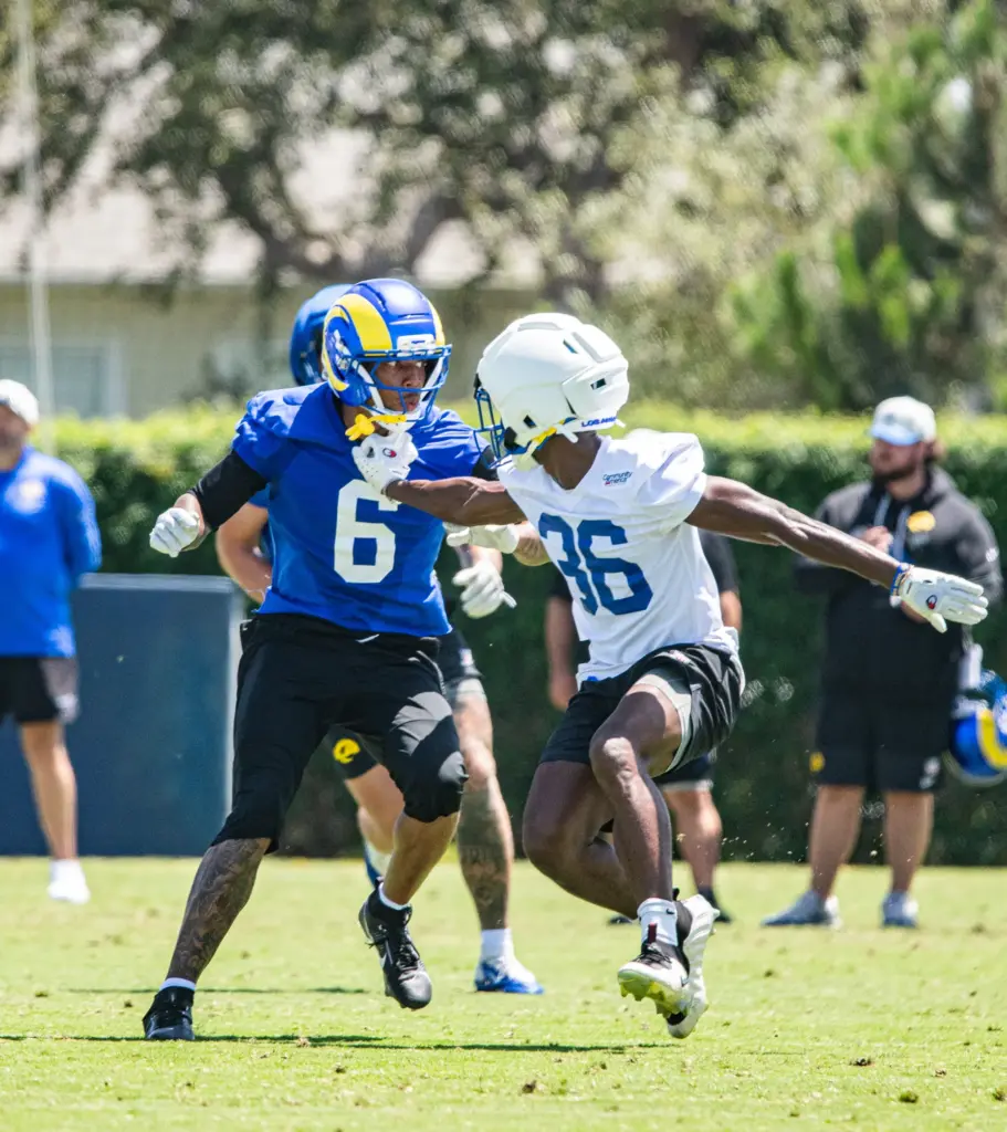 Los Angeles Rams wide receiver CJ Daniels is grabbed by...