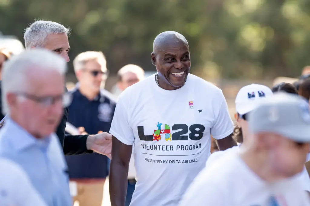 1994 Olympic gold medalist Carl Lewis arrives to help get...