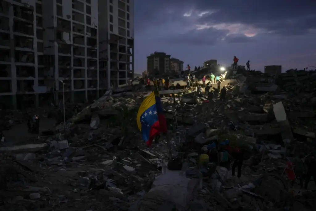 Residents and rescue workers search through the rubble of buildings...