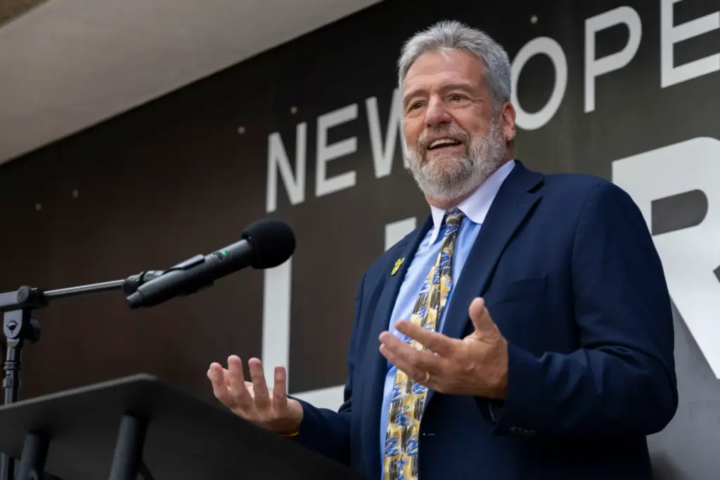 California State Librarian Greg Lucas speaks before celebrating the reopening...