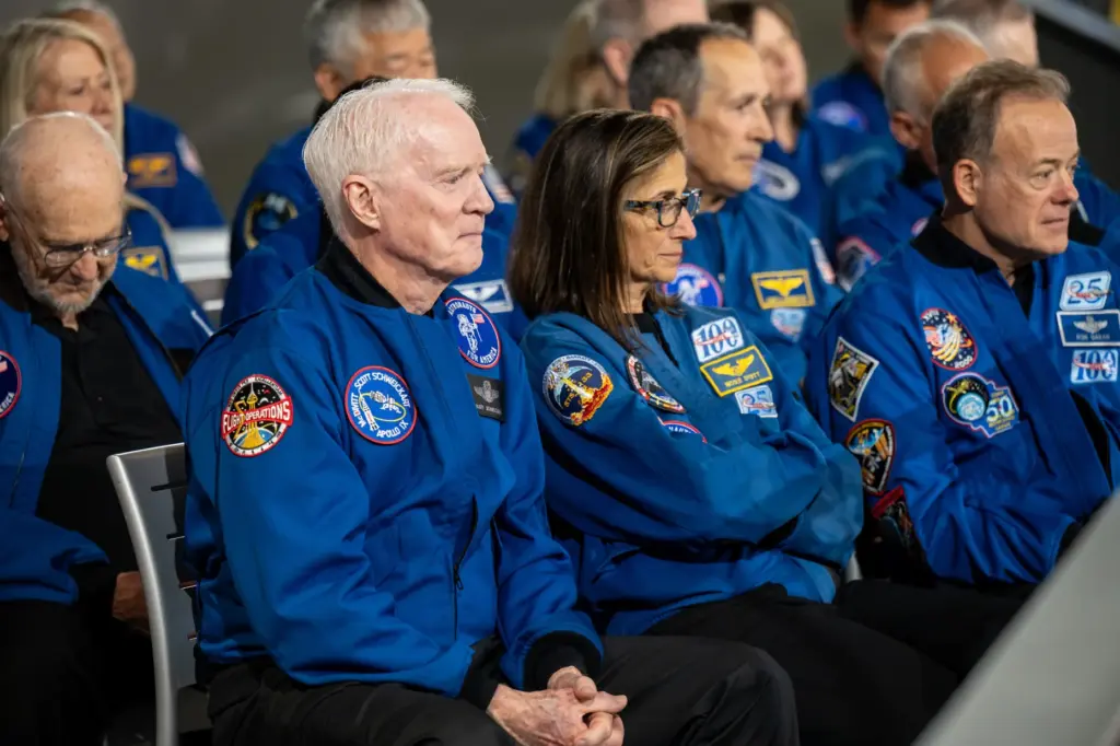 Former Apollo 9 astronaut Scott Schwickart, left-center, and other astronauts...