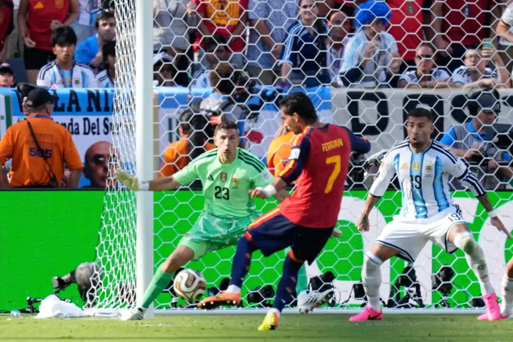 Spain’s Ferran Torres scores the opening goal during the World...