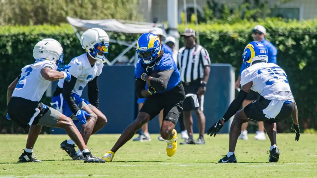 Los Angeles Rams wide receiver Davante Adams is circled by...