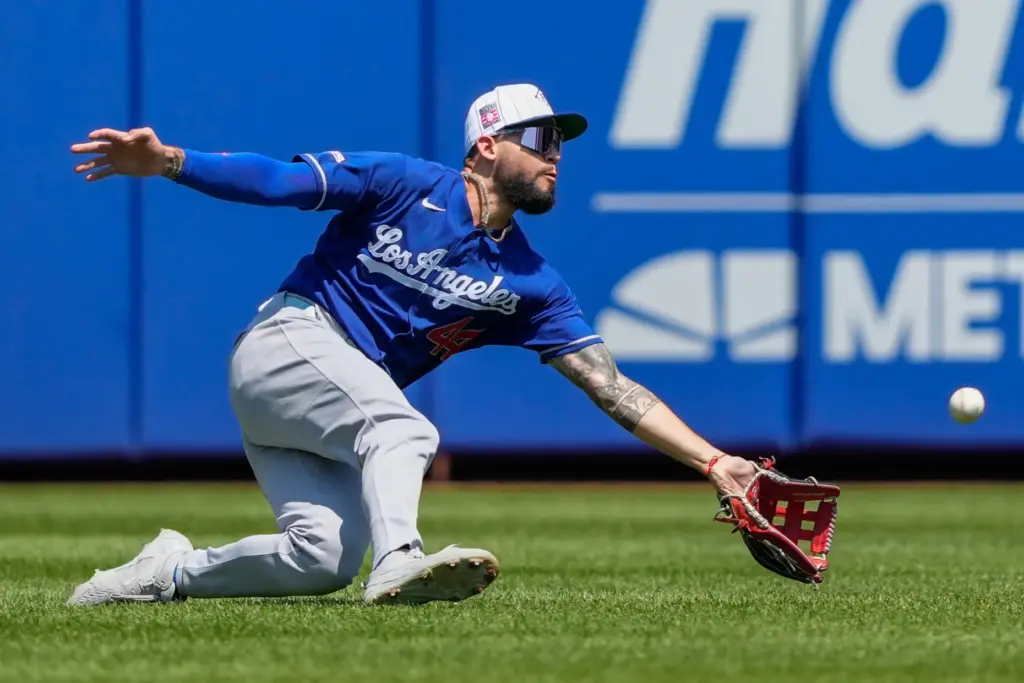 Dodgers center fielder Andy Pages drops a fly ball hit...