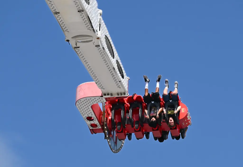 Fairgoers ride Titan during opening day at the OC Fair...