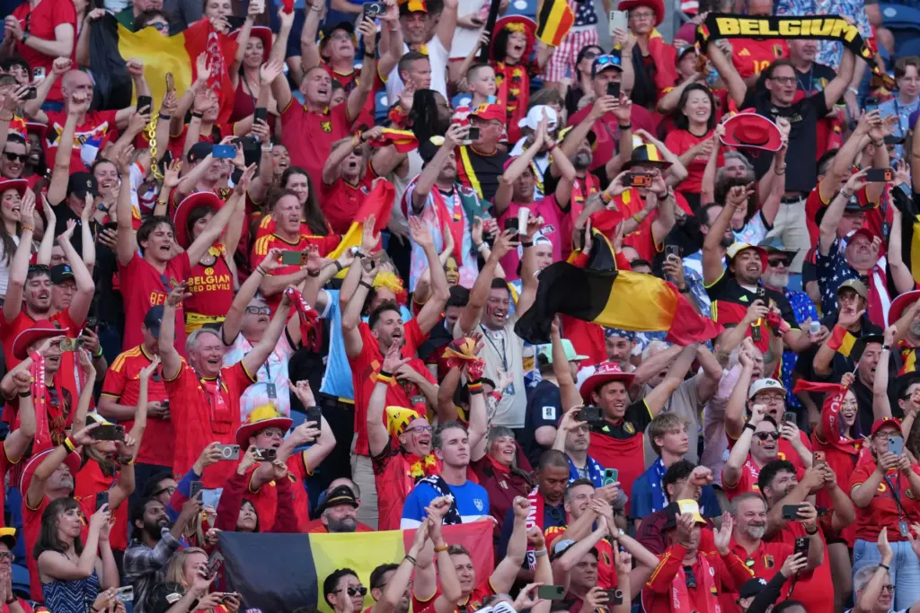 Belgium fans react after they won a World Cup round...