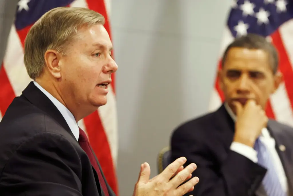 President-elect Barack Obama looks on as Sen. Lindsey Graham speaks.