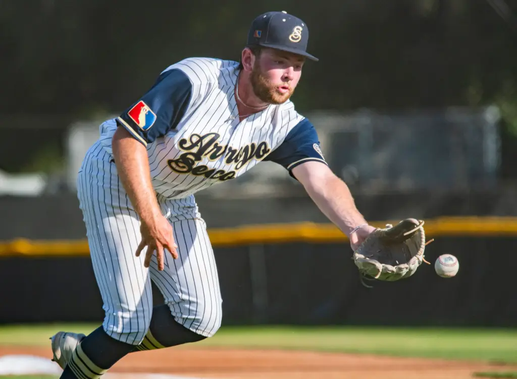 Arroyo Seco Saints right-hander Samuel Rickman flips a ball home...
