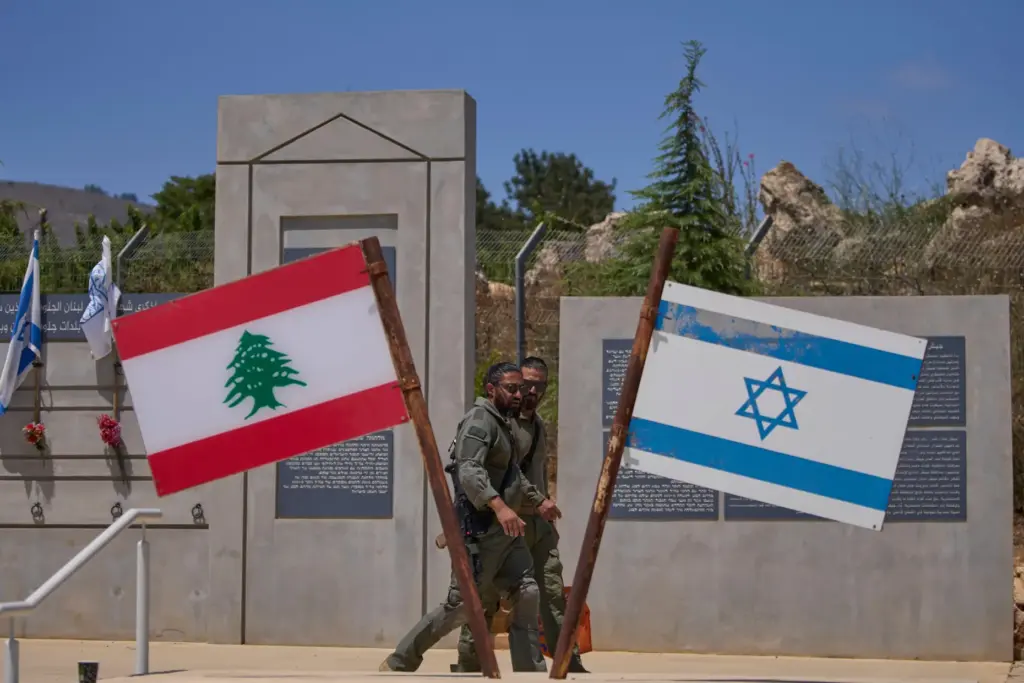 Israeli soldiers are seen at a memorial site on the...