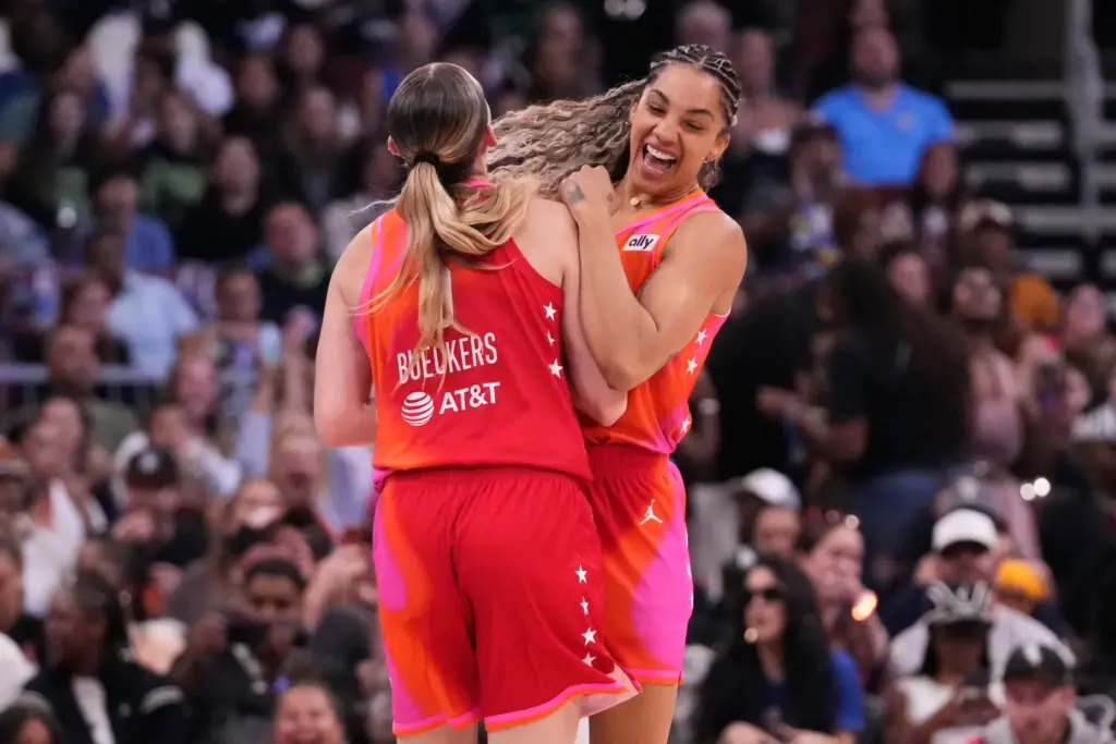 Team Coop’s Gabby Williams, right, celebrates with Paige Bueckers after...