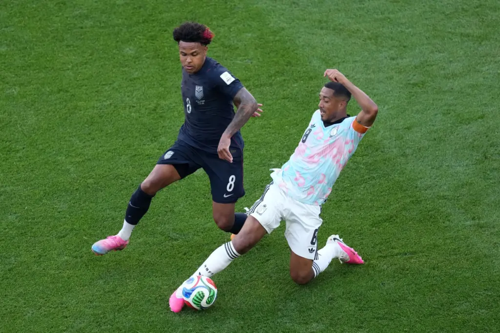 United States’ Weston McKennie (8) challenges Belgium’s Youri Tielemans (8)...