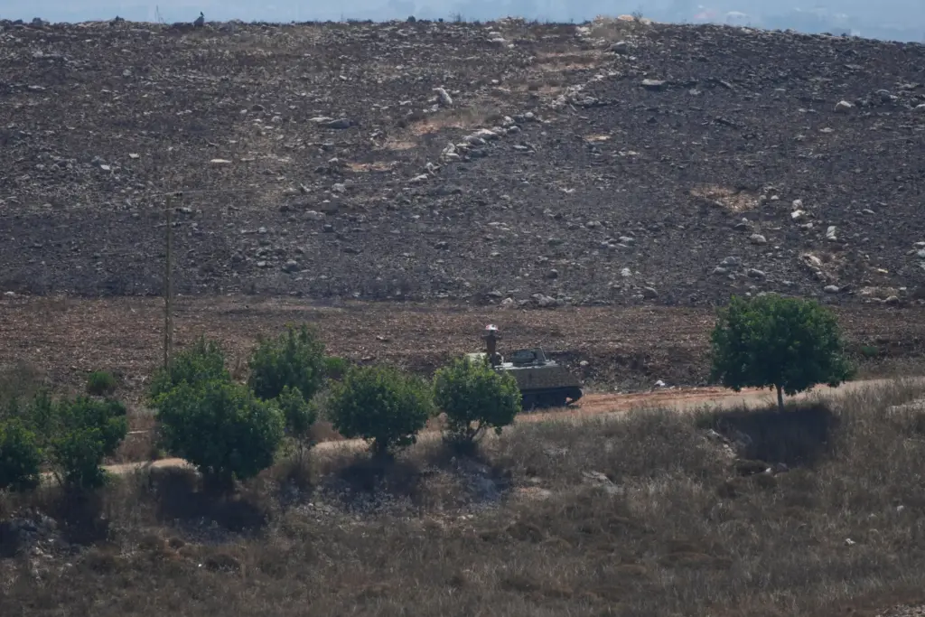 A Lebanese army armored personnel carrier deploys at the entrance to Zawtar Al Gharbieh.