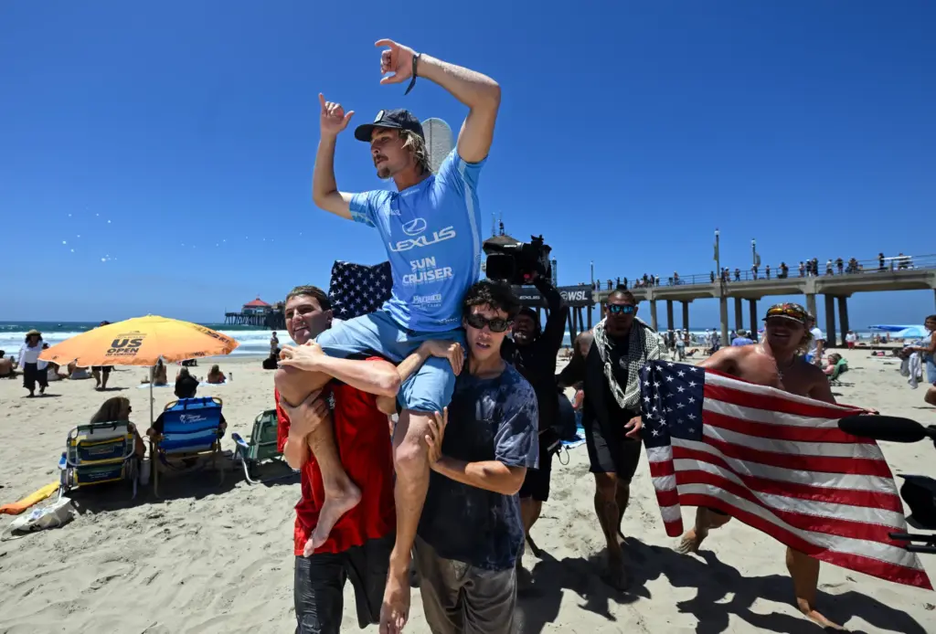 Tommy Coleman celebrates after winning the U.S. Open of Surfing...