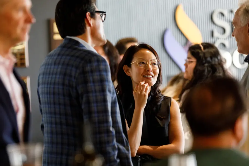 Insurance commissioner candidate Jane Kim speaks with guests at the...