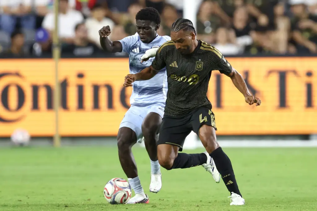 Los Angeles FC defender Eddie Segura, right, vies for the...