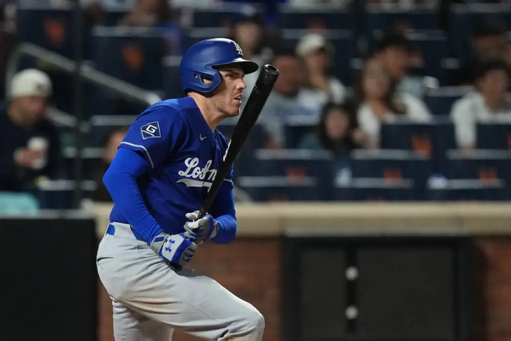 Dodgers’ Freddie Freeman hits a single during the seventh inning...