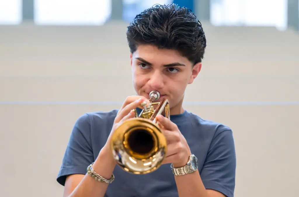 Master class trumpet player, Pedro Fregoso, center, plays a few...
