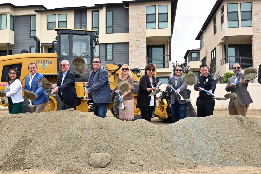 Mayor Ashleigh Aitken, center, joins other officials as they ceremonially...