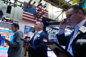 Wall Street inches higher as markets absorb war, tariffs, high energy costs and AI anxiety