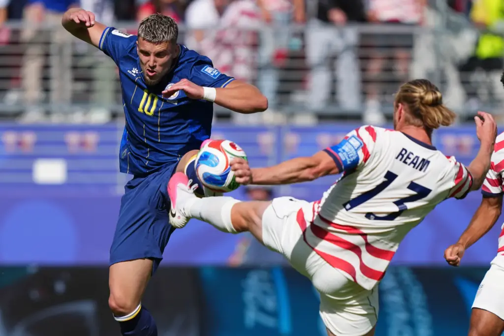 Bosnia’s Ermedin Demirovic (10) and the United States’ Tim Ream...