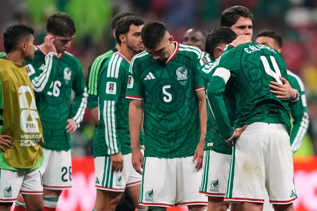 Mexico players react following the World Cup round of 16...