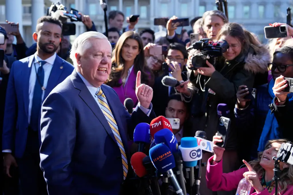 FILE – Sen. Lindsey Graham, R-S.C., speaks to reporters outside...