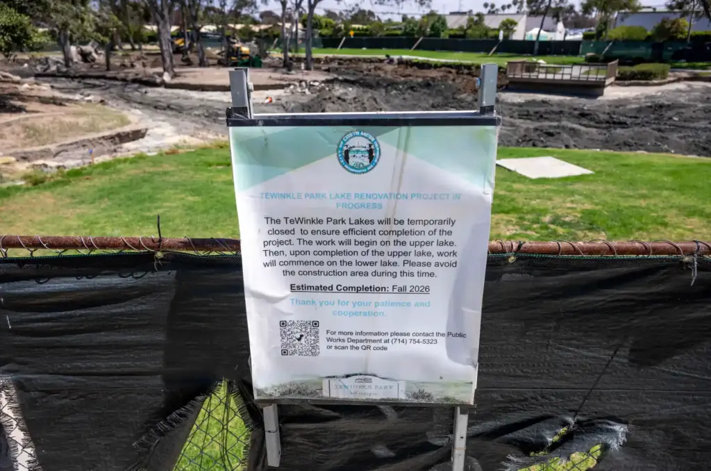 A posted sign informs parkgoers about the ongoing refurbishment project...