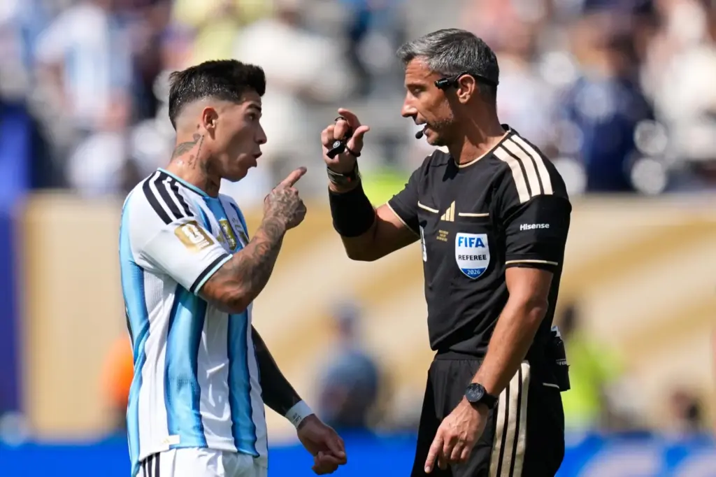 Argentina’s Enzo Fernandez speaks to Referee Slavko Vincic, of Slovenia,...