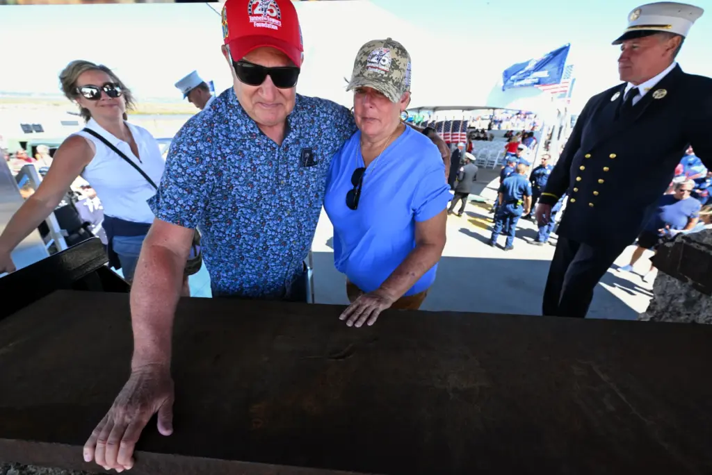 Friends Jim Edmon and Deann Day get emotional as they...