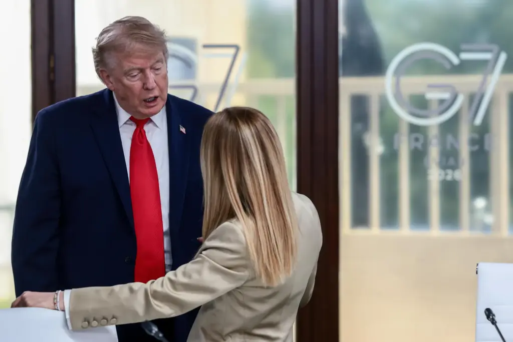 President Donald Trump speaks with Italian Prime Minister Giorgia Meloni.