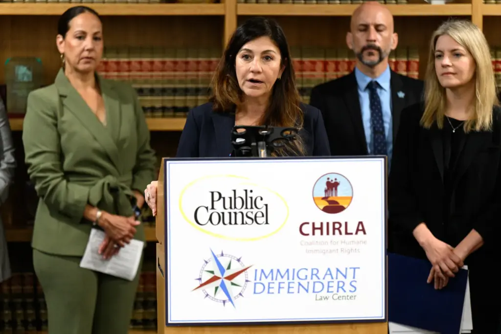 Belinda Escobosa, director of litigation for Public Counsel, speaks at...