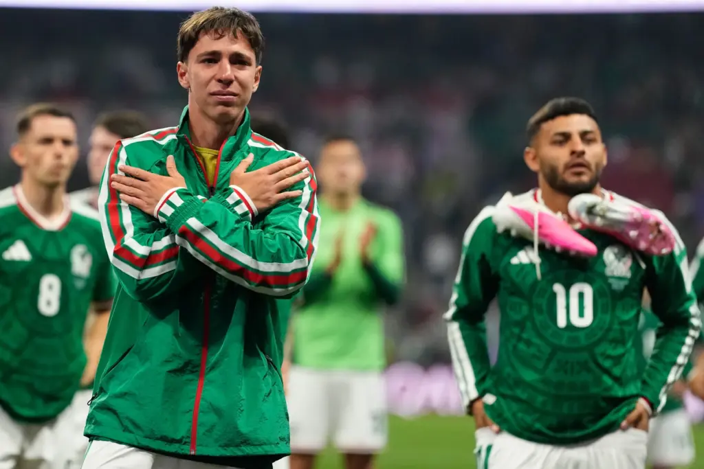 Mexico’s Mateo Chavez, left, reacts with teammates following the World...