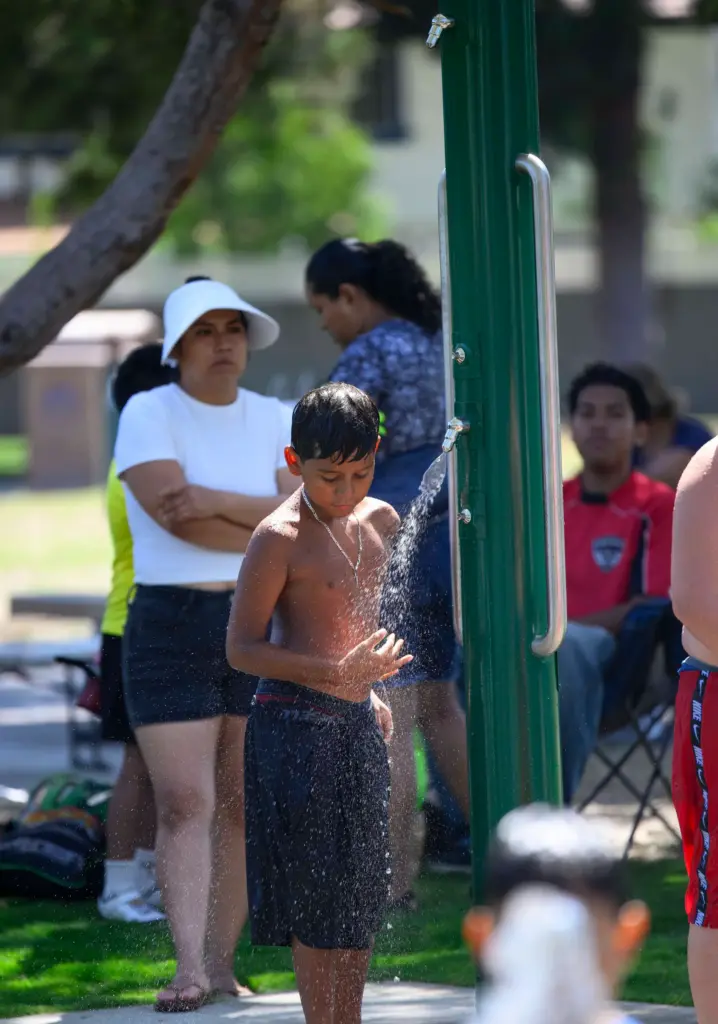The new Splash Pad at Portola Park features outdoor showers...