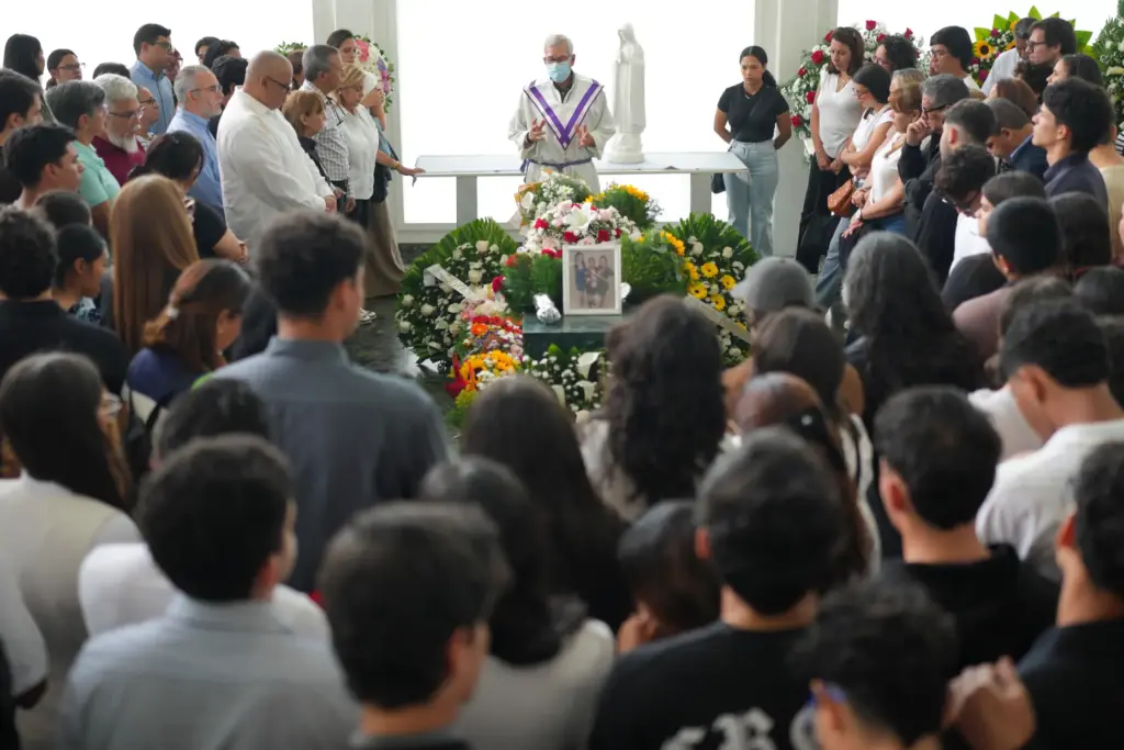 Relatives and friends attend the funeral Mass for Daniela Mora,...