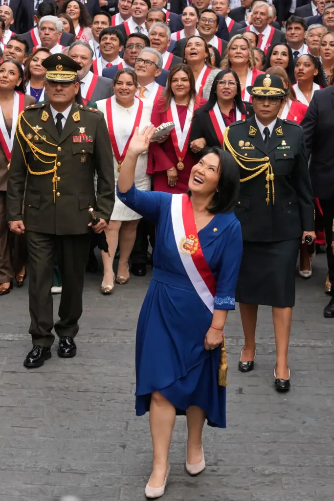 Peru’s President Keiko Fujimori walks to the presidential palace after...