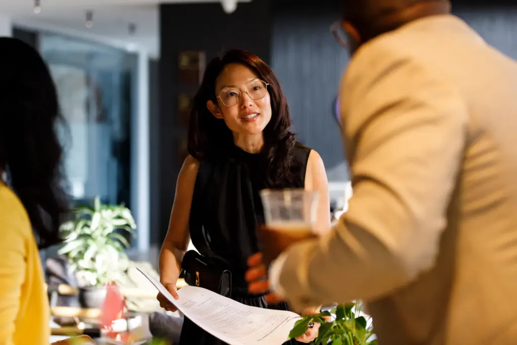 Insurance commissioner candidate Jane Kim speaks with guests at the...