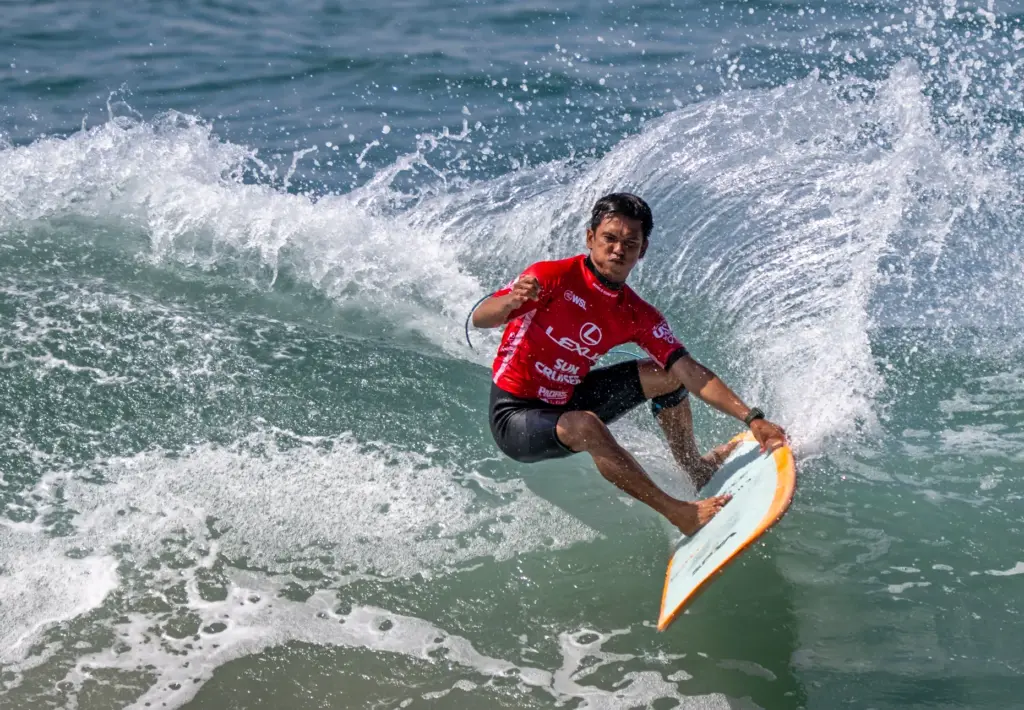 Rogelio Esquievel of the Philippines rides a wave while competing...