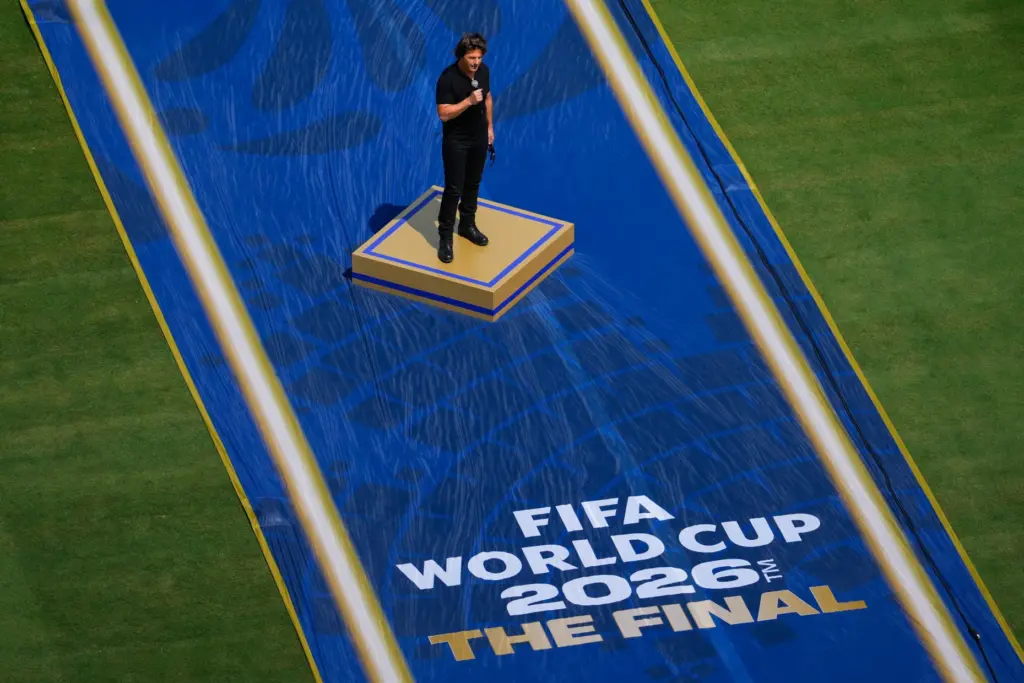 Actor Tom Cruise speaks prior to the World Cup final...