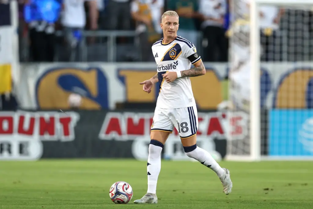 Galaxy midfielder Marco Reus looks to pass the ball during...