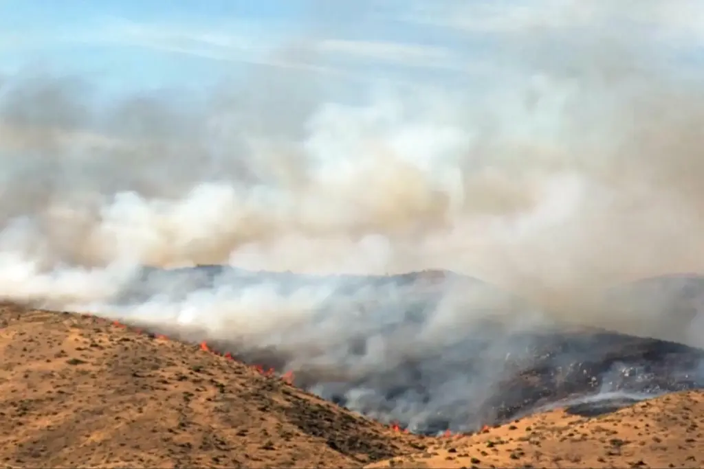 This image taken from video shows active wildfires Saturday, Aug....