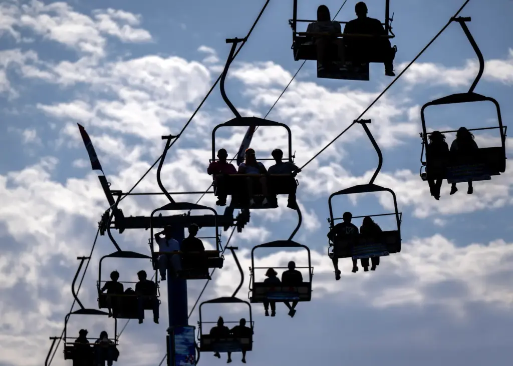 Fairgoers ride the Sky Ride at the OC Fair in...