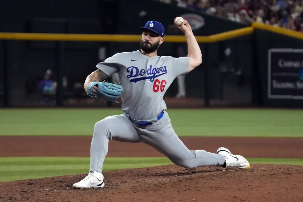 Dodgers relief pitcher Tanner Scott throws to the plate during...