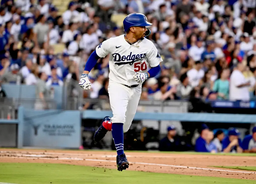 The Dodgers’ Mookie Betts watches the flight of his solo...
