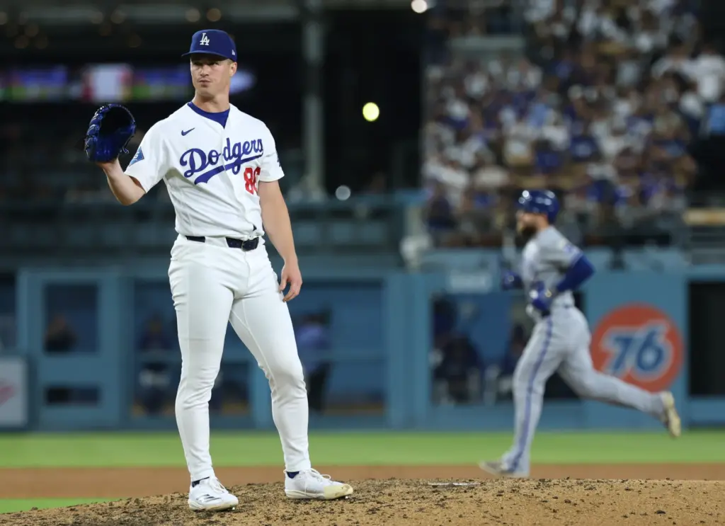 Dodgers relief pitcher Jack Dreyer, left, shows his frustration aftr...