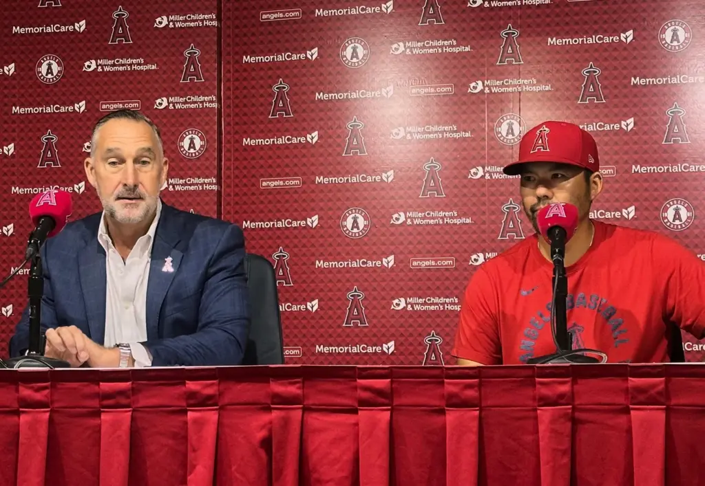 Angels interim general manager John Mozeliak, left, and Angels manager...
