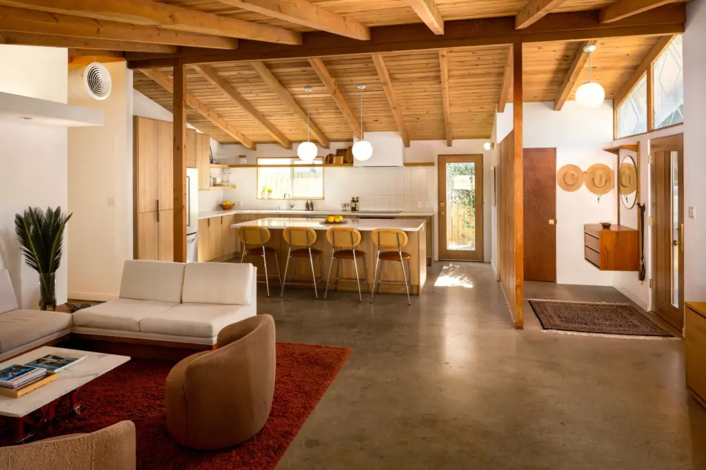 The open-plan living design flows into the updated kitchen. (Photo...