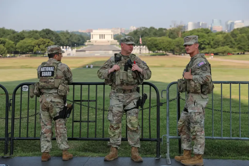 Member of the National Guard patrol at the base of...