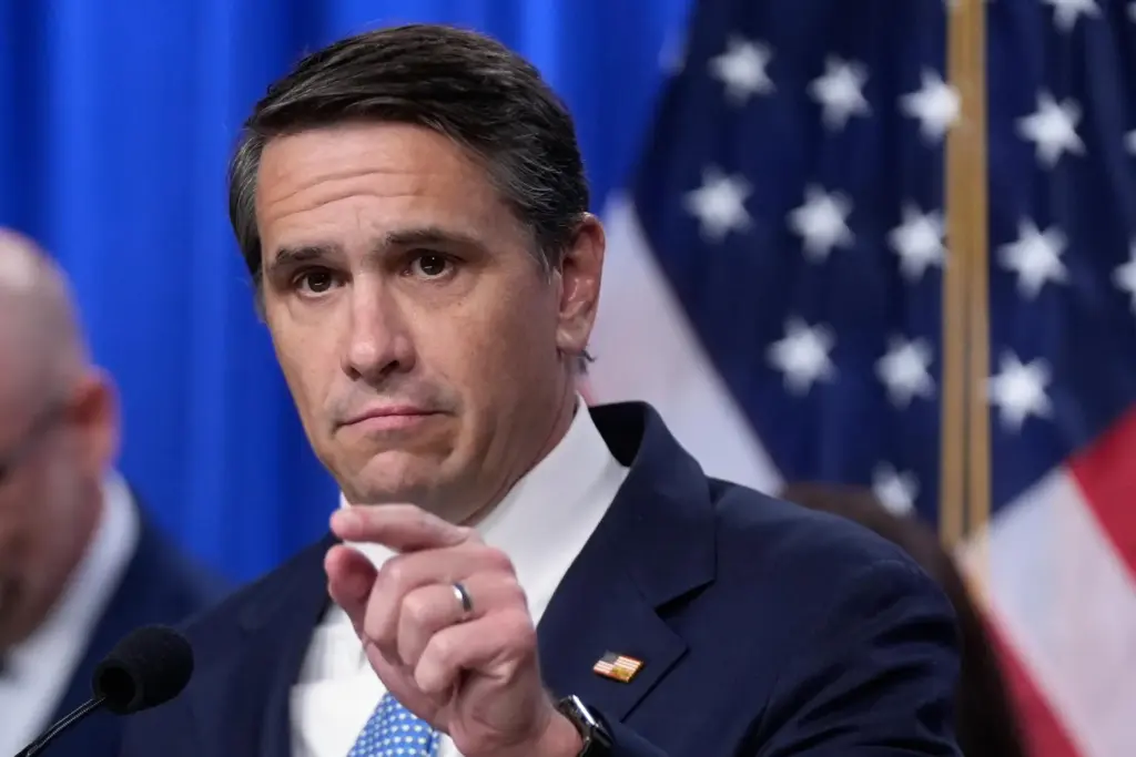 Acting Attorney General Todd Blanche speaks during a news conference.