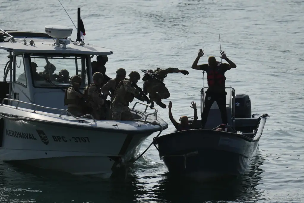 Military personnel train to board boats during a U.S.-sponsored multinational military exercise.