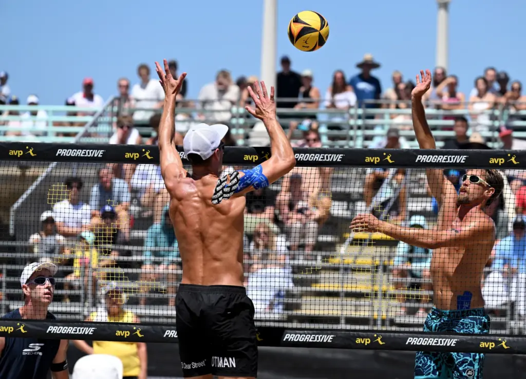 Miles Partain and Paul Lotman play against Taylor Crabb and...